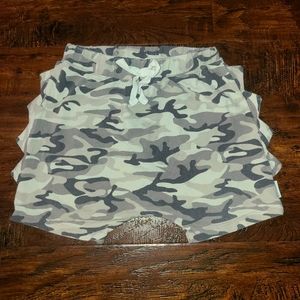 The Mini Classy brand harem shorts with trademark dino spikes along sides.